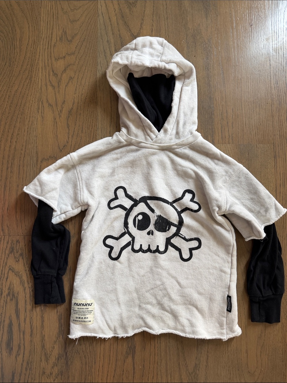 nununu Cream Hoodie with Black Skull Graphic